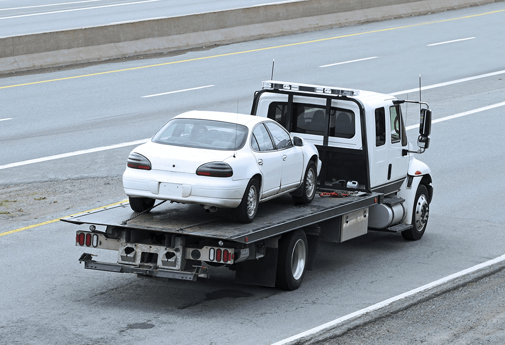 Car towed on a flatbed